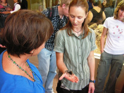 Kyra Perry shows visitors some of the critters at Red Mountain.