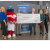 Mesa City Councilmembers, Thor and MCC leaders with AT&amp;T representative around a $70K oversized check. 